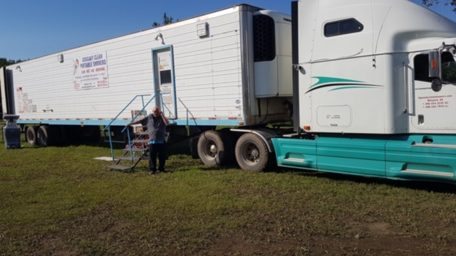 portable shower trailer with 20 shower stalls. 10 women and 10 men